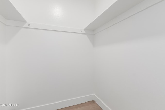 spacious closet with light wood-style floors
