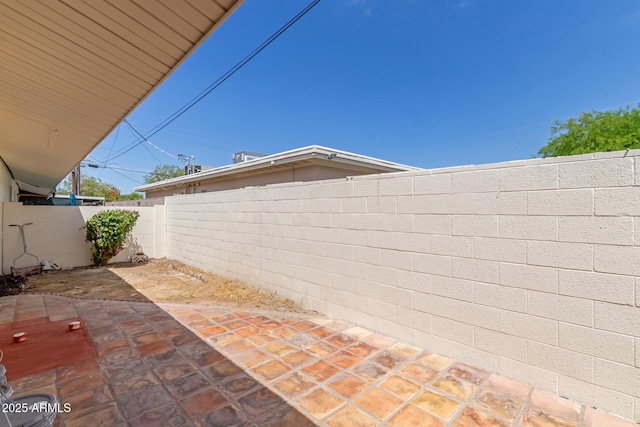 exterior space featuring a fenced backyard
