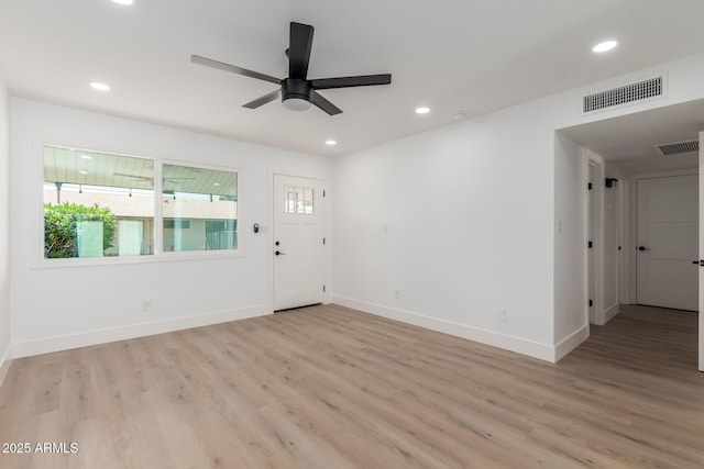 interior space with visible vents, a wealth of natural light, and light wood-style floors