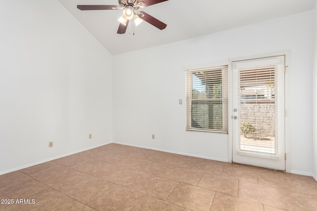 empty room with light tile patterned flooring, ceiling fan, vaulted ceiling, and a wealth of natural light