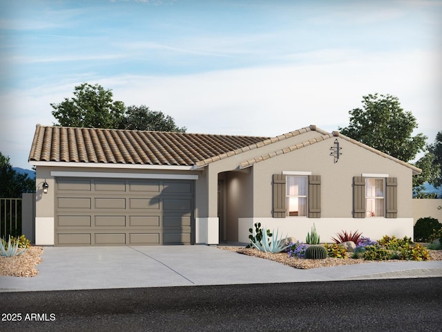 view of front of house featuring stucco siding, concrete driveway, a tile roof, and an attached garage