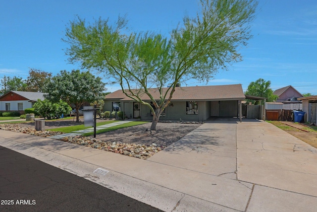 ranch-style home with a carport