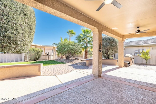 view of patio featuring ceiling fan