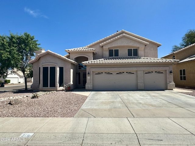 view of front of property featuring a garage