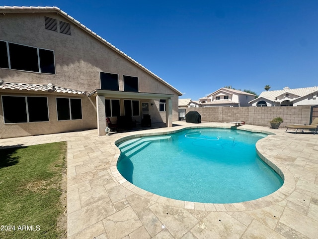 view of pool featuring a patio