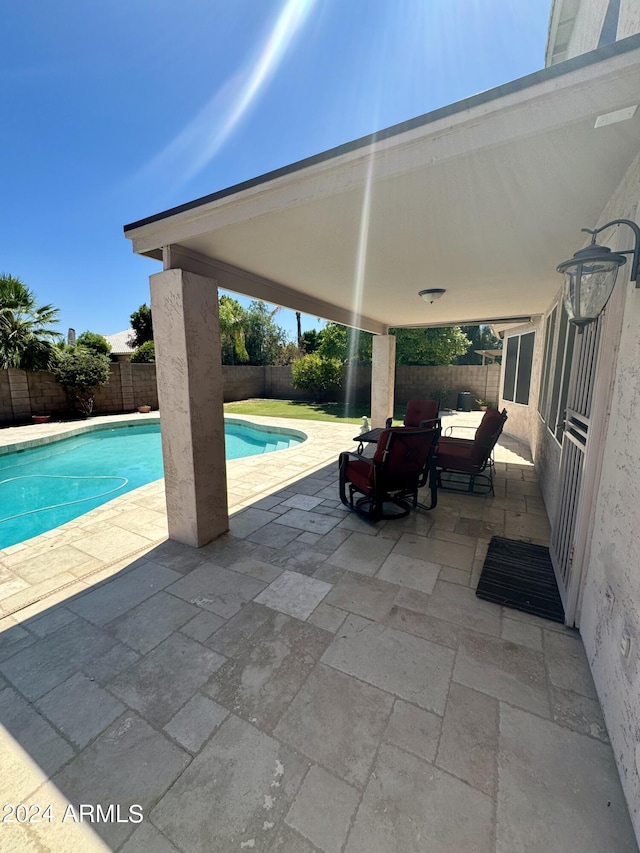 view of swimming pool featuring a patio area