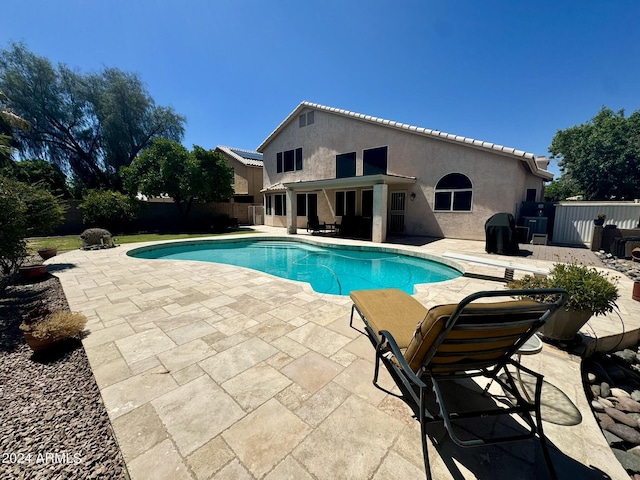 view of swimming pool with a patio area