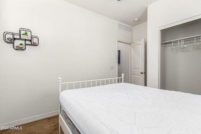 carpeted bedroom featuring a closet