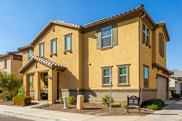 view of front of property with a garage