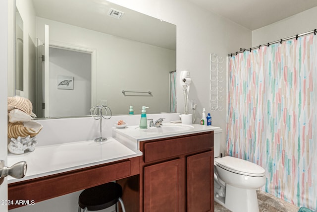 bathroom featuring vanity, toilet, and a shower with shower curtain