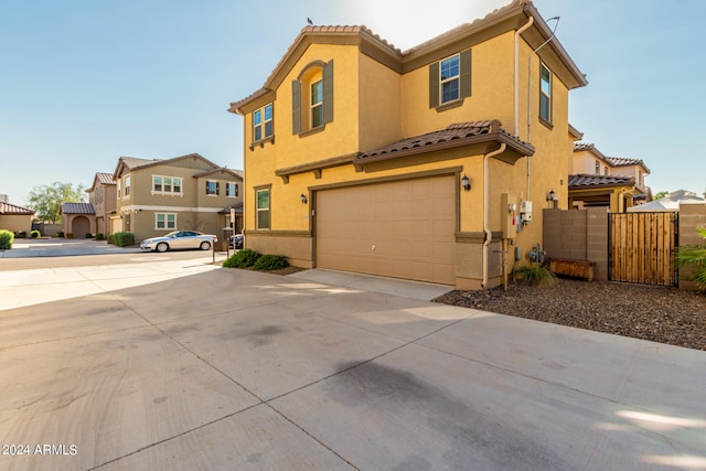 mediterranean / spanish house featuring a garage