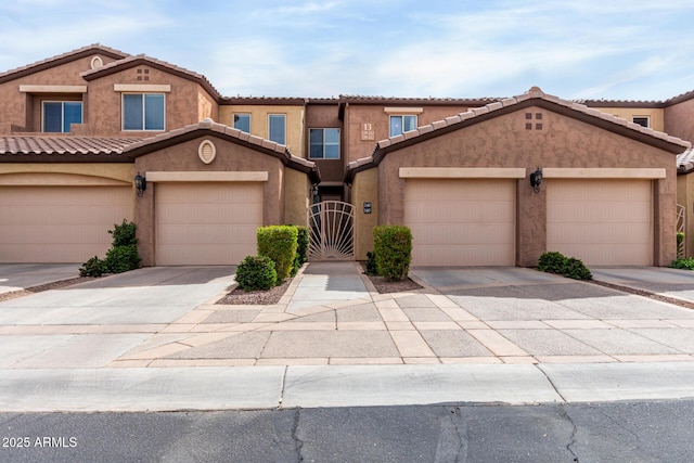 250 W Queen Creek Rd Unit 240, Chandler, AZ 85248 - view of front facade with a tile roof, a gate, concrete driveway, and stucco siding