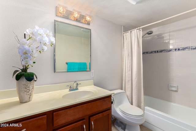 full bathroom with vanity, toilet, shower / bath combo with shower curtain, and a textured ceiling