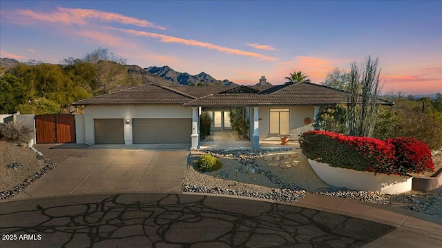 view of front of house featuring a mountain view and a garage