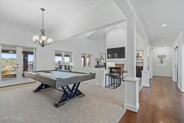 recreation room featuring ornate columns, billiards, wood-type flooring, crown molding, and french doors