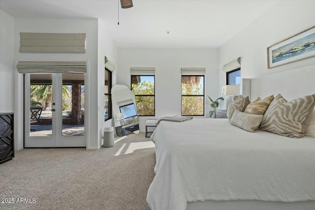 bedroom with multiple windows, carpet, access to outside, and ceiling fan