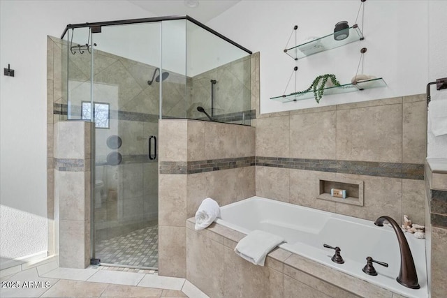 bathroom featuring separate shower and tub