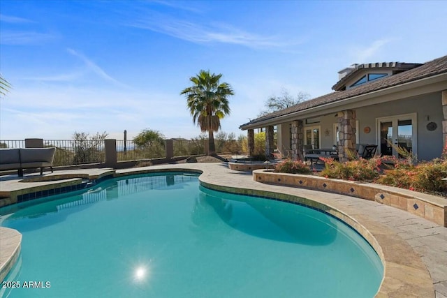 view of swimming pool featuring a patio area