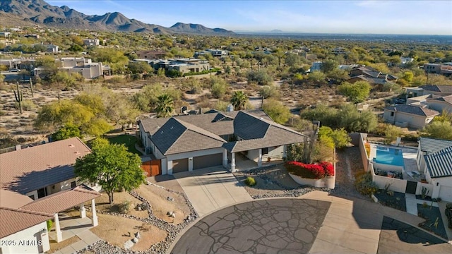 birds eye view of property featuring a mountain view