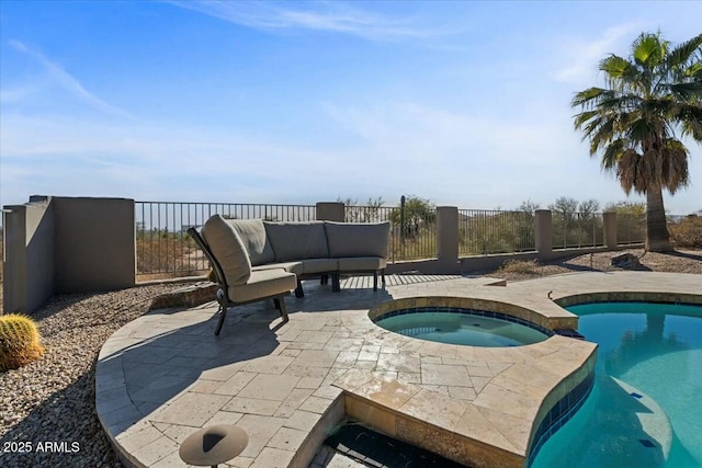 view of pool featuring an in ground hot tub and a patio area