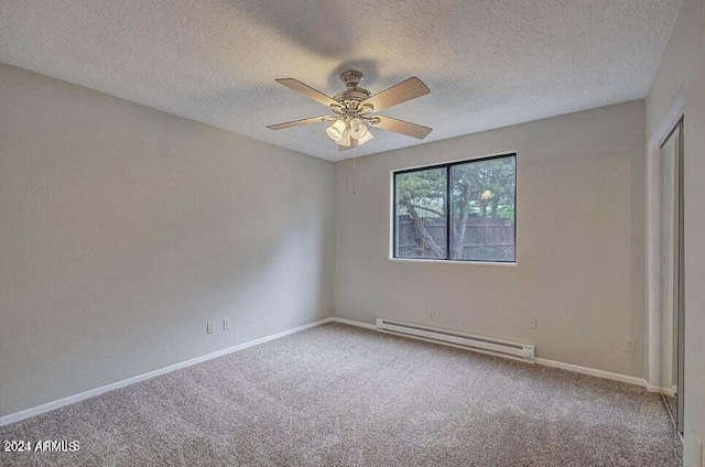 empty room with carpet, ceiling fan, a textured ceiling, and a baseboard radiator