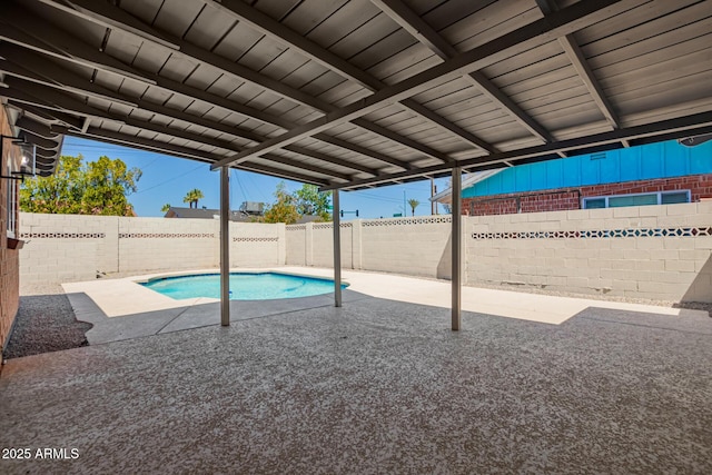 view of pool featuring a fenced backyard and a patio