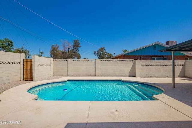 view of swimming pool with a fenced in pool, a patio, and a fenced backyard