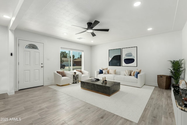 living room featuring visible vents, recessed lighting, light wood-style floors, and ceiling fan