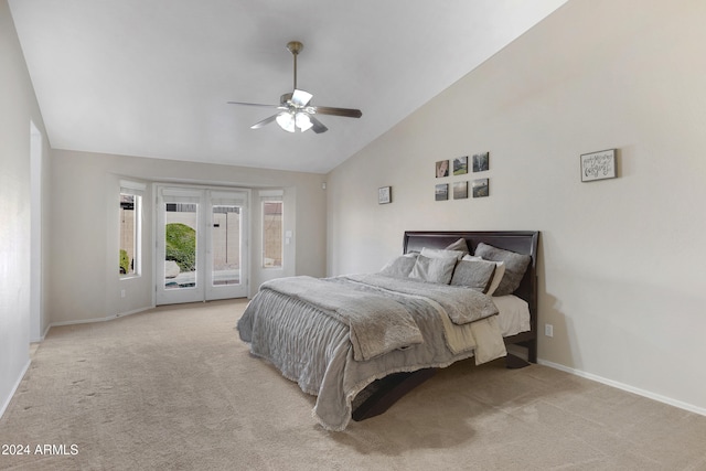 bedroom with access to exterior, light colored carpet, high vaulted ceiling, and ceiling fan