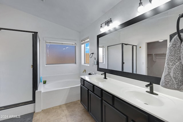 bathroom featuring tile patterned flooring, vanity, vaulted ceiling, and independent shower and bath