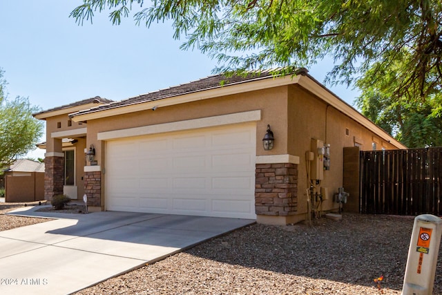 view of side of property with a garage