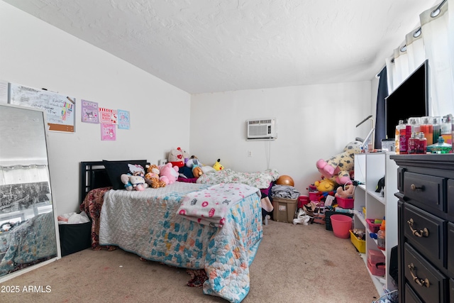 bedroom featuring a wall mounted AC and carpet floors