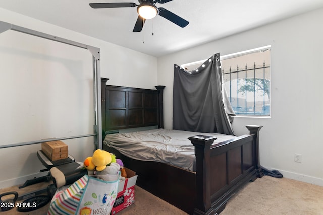 bedroom with ceiling fan and light colored carpet