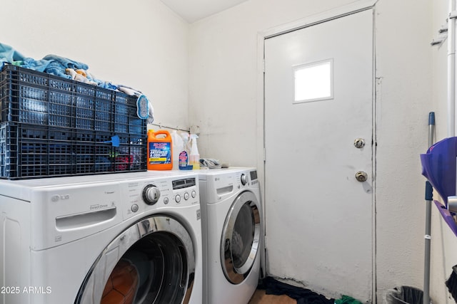 washroom with separate washer and dryer