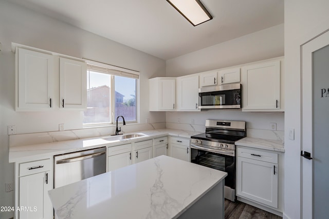 kitchen featuring white cabinets, sink, and appliances with stainless steel finishes