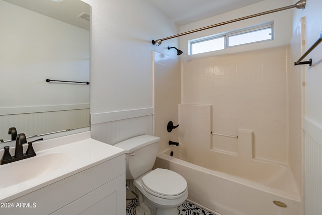 full bathroom featuring vanity, toilet, and tiled shower / bath combo