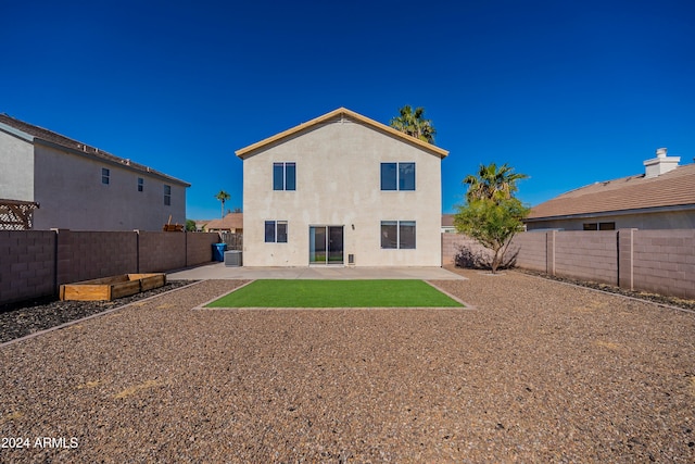 rear view of property with a patio area