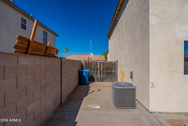 view of property exterior featuring central air condition unit and a patio area