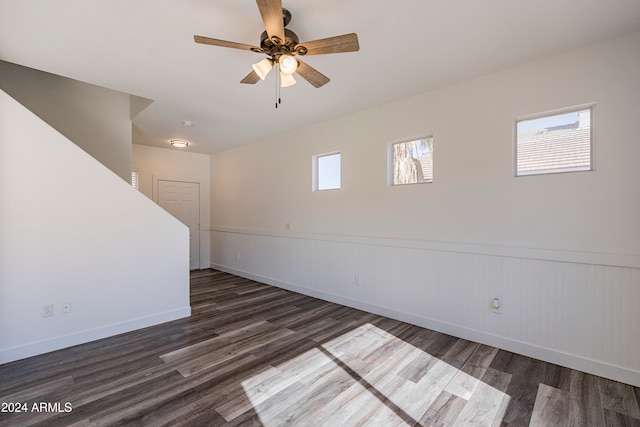 spare room featuring ceiling fan and dark hardwood / wood-style floors