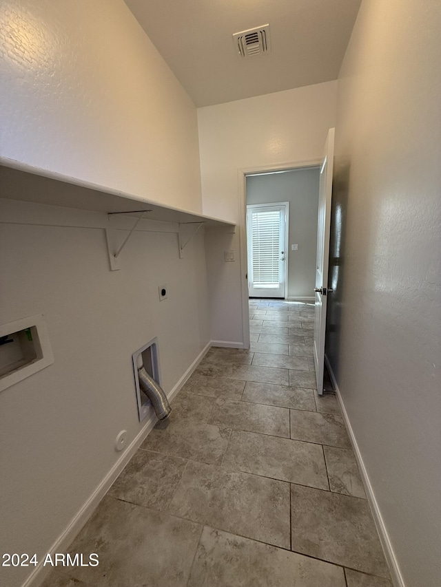 laundry area with hookup for an electric dryer, gas dryer hookup, and hookup for a washing machine