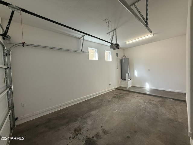 garage with electric water heater and a garage door opener