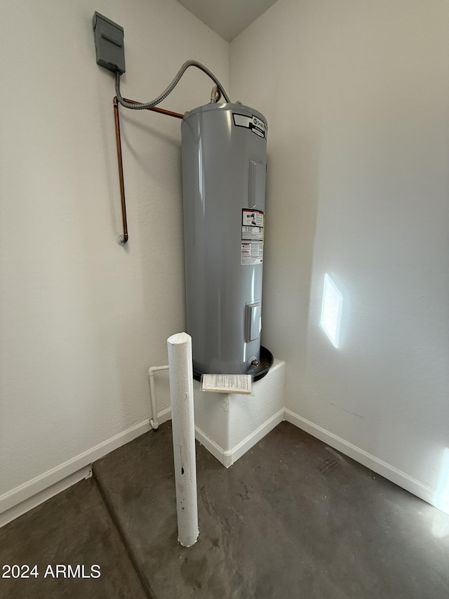 utility room featuring electric water heater