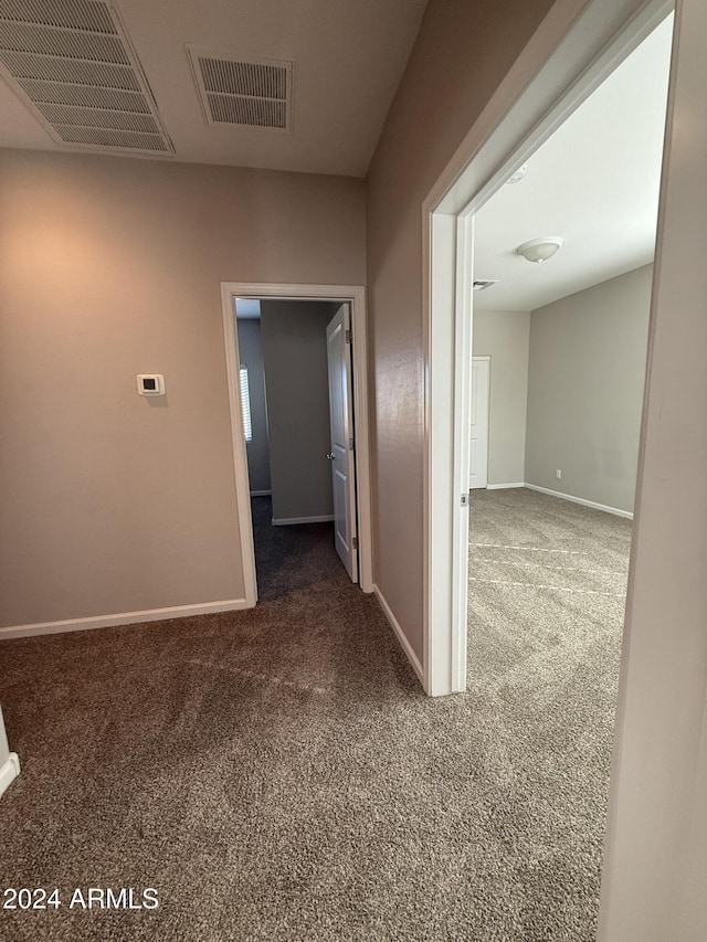 hallway with carpet