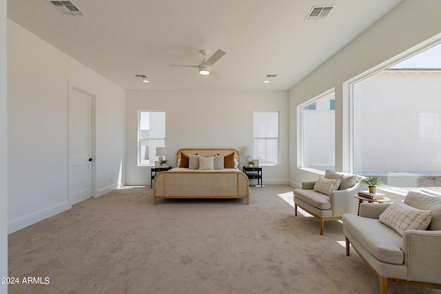 bedroom featuring ceiling fan and light carpet