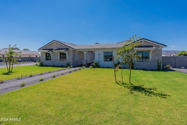 ranch-style house with a front yard