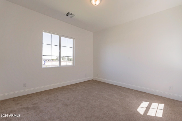 empty room featuring light colored carpet