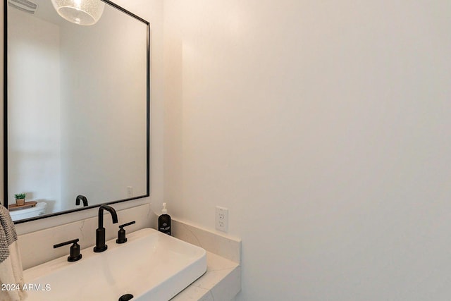 bathroom featuring sink and toilet