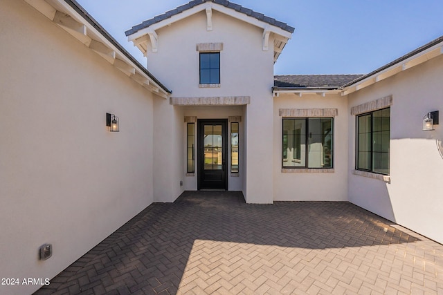 back of property with a patio