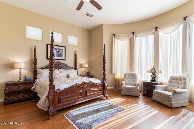 bedroom with light wood-type flooring and ceiling fan