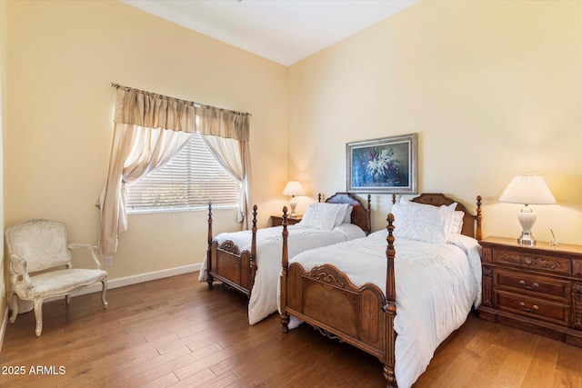 bedroom with hardwood / wood-style flooring